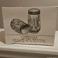 Original box with image and branding showing Gorham full lead crystal salt and pepper shakers