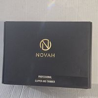 Top of the closed black box with gold Novah logo and text 'Professional Clipper and Trimmer'.