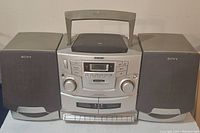 Full front view of the Sony CFD-ZW755 boombox showing stereo speakers, dual cassette decks, control panel, and handle.