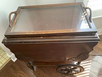 Top side view showing removable glass tray with handles fitted on the tea cart.