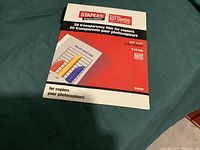 Close-up of Staples brand transparency film pack with 20 sheets for copiers, 8.5 x 11 inches.