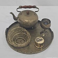 Photo showing the full lot including teapot, goblet, small trinket box, serving tray and collapsible basket on the tray.