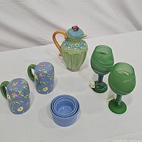 Photo showing full lot with ceramic pitcher, salt and pepper shakers, ramekins, and green glass goblets.