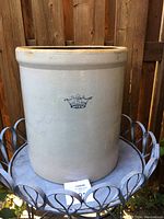 Front view of the 5 gallon Ransbottom stoneware crock showing beige exterior and crown stamp with number 5