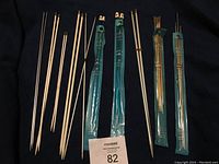 Several knitting needle sets in different sizes including packaged and unpackaged needles