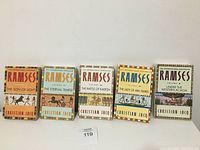 Front covers of the five Ramses books by Christian Jacq, arranged in a row.