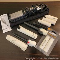 Lot contents showing one Infiniti Professional Ceramic Hair Straightener with cord and pouch, two Black & Decker cordless curling irons with brush attachments and two white butane thermacells in Conair packaging plus instruction manual.