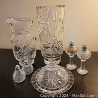 Full view of all Pinwheel crystal pieces including vase, pitcher, salt and pepper shakers, covered butter dish, and dessert nappies grouped on table