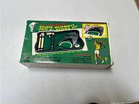 Box of Deluxe Automatic Putt Putt Return Set showing contents and graphics