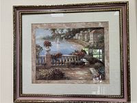 Frontal image of the framed scenic picture featuring the coastal terrace and sailboat view.