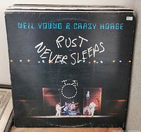 Front view of Neil Young & Crazy Horse "Rust Never Sleeps" album cover in vinyl record lot