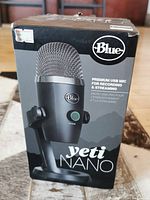 Front view of the Blue Yeti Nano microphone box showing product image and branding.