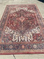 Complete view of 9x6 area rug with traditional dark red, cream, and navy design showing intricate geometric and floral motifs
