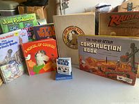 Photo showing a variety of vintage hardcover children's books including Star Wars themed books, pop-up books, and other classic children's titles.