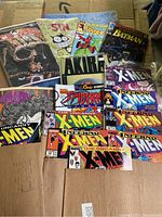 Overview photo showing Dead World, SIN, Peter Porker Spider-Man, Detective Batman, AKIRA, and multiple X-Men comics