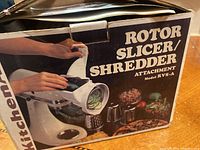 Original box of the KitchenAid Rotor Slicer Shredder Attachment showing model number, image of the product in use, and the vintage style packaging.
