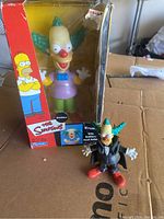 Vintage Krusty the Clown bobblehead in original box with small posable Dracula figure in front