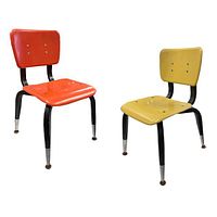 Pair of 1960s children’s chairs, one orange, one yellow, fiberglass seats and backs, black metal legs with silver metal tipped feet