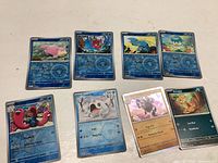 Photo showing all 8 shiny Pokémon cards, including Slowpoke, Octillery, Carnivine, Cetoddle, Scraggy and Annihilape.