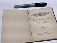 Open book showing title page with decorative header and publishing details.