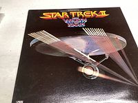 Front cover of the Star Trek II: The Wrath of Khan soundtrack vinyl record showing the USS Enterprise spaceship and title.