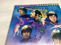 Front cover of The Turtles Golden Hits album showing colorful artistic drawings and band member portraits.