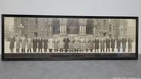 Framed panoramic black and white photograph of the Toronto Boy Municipal Council from 1930, showing all members lined up in front of a stone building.