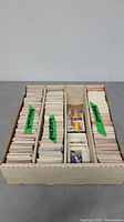 Wooden box holding over 2000 baseball cards organized in three vertical compartments labeled 'Baseball'