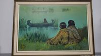 Full view of the painting showing two Native Indian figures sitting by the water observing a canoe with a figure inside, framed with matte border.
