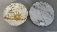 Top view of the porcelain bowl and marble heat stand placed side by side on a grey surface