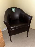 Front diagonal view showing shape, legs, and upholstery condition.