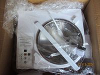 Packaged white chocolate tempering machine with stainless steel bowl and attached control panel