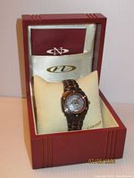 Oniss Galaxy ladies watch displayed in original red Oniss box with cream cushion and documentation folder.