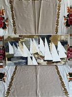 Full view of painting showing abstract sailboats on canvas against beige and gray background