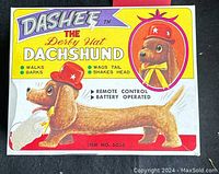 Box front showing image and features of Dashee the Derby Hat Dachshund remote control toy.
