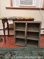 Petite wooden bench with upholstered seat in pastoral scene fabric with turned legs and vintage blue painted wooden tray with four compartments and handle.