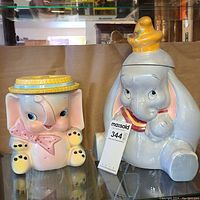Both vintage elephant cookie jars side by side showing overall size and condition.