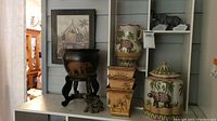 Overview of all safari themed vases and containers along with framed elephant print, showing size and design details