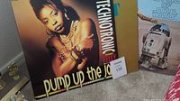 Photo showing front cover of Technotronic album with a female artist on cover and Star Wars album partially visible.