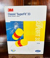 Front view of 3M Classic SuperFit 33 earplugs packaging showing product name, image of earplugs, and 3M logo.