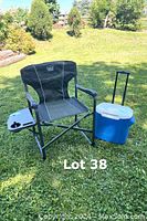 Full view of Timber Ridge camping chair with cooler placed on grass backdrop.