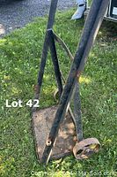 Side view of the solid metal welding tank cart showing frame, wheels, and chain attachment points.