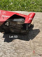 Red box of GE halogen headlight system model H4656 with 4 low beam headlights, box slightly damaged.