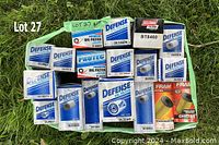 Photo showing 18 new oil filters in original packaging placed on grass with label.