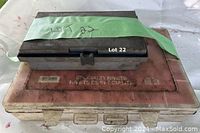 Stacked cases: a large plastic case labeled 'Specialty Rivets' with a smaller dark case on top