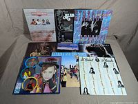 Front view of 9 vinyl records in the lot showing album covers of various artists including Little River Band, Alabama, Strange Advance, The Pointer Sisters, Ricky Skaggs, Rick Springfield, Culture Club, Katrina and the Waves, and Al Stewart.