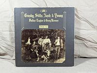 Front cover of Crosby, Stills, Nash & Young 'Déjà Vu' vinyl LP album with visible wear on corners and edges
