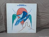 Front cover of Eagles 'On The Border' LP, featuring stylized eagle artwork with desert and lightning motif.