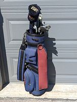 Photo of full golf bag with clubs visible, showing the overall set with woods and irons.