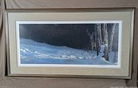 Full view of framed print showing white-tailed deer in snowy landscape